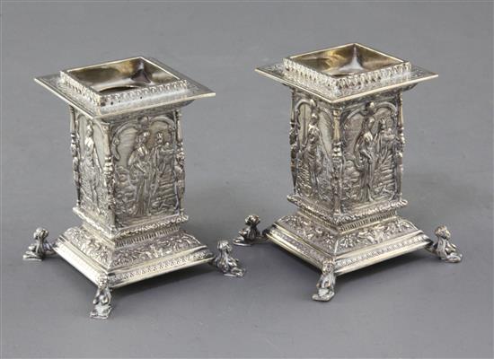 An ornate pair of George V silver dwarf candlesticks by Wakely & Wheeler, 11 oz.
